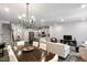 Open-concept living space features hardwood floors, recessed lighting, and seamless flow into the kitchen at 309 Millennium Dr, Pittsboro, NC 27312
