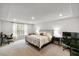 Spacious primary bedroom features tray ceiling and bright windows at 309 Millennium Dr, Pittsboro, NC 27312