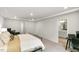 Bright primary bedroom featuring tray ceiling and large windows at 309 Millennium Dr, Pittsboro, NC 27312
