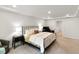 Bright primary bedroom with tray ceiling and comfortable bed at 309 Millennium Dr, Pittsboro, NC 27312