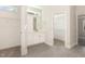 En-suite bathroom features double sinks, modern vanity, tile floor, and walk-in closet access at 32 Bonnybrook Ct, Selma, NC 27576