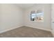 Carpeted bedroom with a large window providing abundant natural light and community views at 32 Bonnybrook Ct, Selma, NC 27576