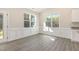 Bright dining area with large windows, providing scenic outdoor views at 32 Bonnybrook Ct, Selma, NC 27576