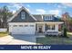 Charming single-story home featuring a two-car garage, beautiful stonework, and a well-manicured front yard at 32 Bonnybrook Ct, Selma, NC 27576