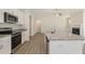 Modern kitchen features stainless steel appliances, granite counters, and an island with sink at 32 Bonnybrook Ct, Selma, NC 27576