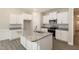 Modern kitchen featuring granite countertops, stainless steel appliances, and ample storage at 32 Bonnybrook Ct, Selma, NC 27576