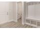 Well organized mudroom includes built in bench, storage shelves and coat hooks at 32 Bonnybrook Ct, Selma, NC 27576