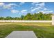 Expansive backyard featuring a lush lawn, privacy fence, and a patio area perfect for outdoor enjoyment at 33 W Emily Gardens Dr, Selma, NC 27576