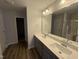 Bathroom featuring double vanity, framed mirror, and tile flooring at 33 W Emily Gardens Dr, Selma, NC 27576