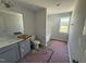 Bathroom with a single vanity, toilet, tub/shower combo, and natural light from window at 33 W Emily Gardens Dr, Selma, NC 27576