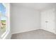 Bright bedroom features soft carpet, double door closet, and natural light from a large window at 33 W Emily Gardens Dr, Selma, NC 27576
