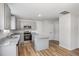 Bright kitchen with gray cabinets, stainless steel appliances, and a functional island at 33 W Emily Gardens Dr, Selma, NC 27576