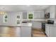 Modern kitchen featuring gray cabinets, granite countertops, and stainless steel appliances at 33 W Emily Gardens Dr, Selma, NC 27576