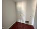 Compact, unfinished laundry room with hookups and a pet door at 33 W Emily Gardens Dr, Selma, NC 27576