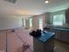 Open floor plan with views of the kitchen featuring stainless steel appliances and an island with cabinets at 33 W Emily Gardens Dr, Selma, NC 27576