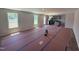 Spacious living room with abundant natural light and views of the backyard and open access to the kitchen at 33 W Emily Gardens Dr, Selma, NC 27576