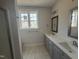 Bathroom with dual sink vanity, modern fixtures and a walk-in shower at 40 Bailey-Boykin Rd, Selma, NC 27576