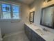 Elegant bathroom with double vanity, stylish mirrors, and a spacious countertop area, filled with natural light at 40 Bailey-Boykin Rd, Selma, NC 27576