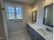 Bright primary bathroom with double sinks, modern fixtures, and neutral colors at 40 Bailey-Boykin Rd, Selma, NC 27576