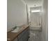 Cozy bathroom showcasing a shower-tub combo and a single sink vanity at 40 Bailey-Boykin Rd, Selma, NC 27576