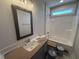 Clean bathroom showcasing a single vanity, a large mirror, and a shower-tub combination perfect for everyday use at 40 Bailey-Boykin Rd, Selma, NC 27576