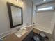 Bathroom with a large vanity, mirror, and shower-tub combination at 40 Bailey-Boykin Rd, Selma, NC 27576