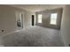 Light-filled bedroom with neutral tones and ample natural light from two windows at 40 Bailey-Boykin Rd, Selma, NC 27576