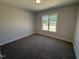 Cozy bedroom with a large window, offering natural light and a view of the outdoors at 40 Bailey-Boykin Rd, Selma, NC 27576
