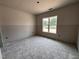 Bedroom featuring a large window for natural light at 40 Bailey-Boykin Rd, Selma, NC 27576