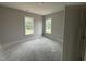 Bright bedroom filled with natural light from two large windows, providing a comfortable and inviting space at 40 Bailey-Boykin Rd, Selma, NC 27576