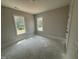 Well-lit bedroom with large windows, ready for your personal touch at 40 Bailey-Boykin Rd, Selma, NC 27576