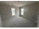 Bright bedroom with dual windows providing abundant natural light at 40 Bailey-Boykin Rd, Selma, NC 27576