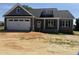 Charming craftsman-style home with a two-car garage and stone accents, offering modern curb appeal at 40 Bailey-Boykin Rd, Selma, NC 27576