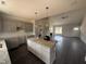 Modern kitchen featuring an island with pendant lighting, grey cabinets and stainless appliances at 40 Bailey-Boykin Rd, Selma, NC 27576