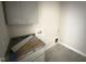 Functional laundry room with ample cabinet space and granite countertop, designed for convenience and efficiency at 40 Bailey-Boykin Rd, Selma, NC 27576