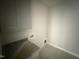 Practical laundry room with granite countertops and ample cabinet storage at 40 Bailey-Boykin Rd, Selma, NC 27576