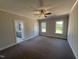 Main bedroom featuring ceiling fan, carpet, and ensuite bathroom at 40 Bailey-Boykin Rd, Selma, NC 27576