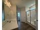 Bathroom showcasing a modern vanity with solid surface countertop and glass door shower stall at 40 Tuskeegee Dr, Smithfield, NC 27577