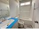 Bright bathroom featuring a tub-shower combo and a modern vanity with a large mirror at 40 Tuskeegee Dr, Smithfield, NC 27577