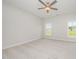 A bright bedroom with a ceiling fan and carpeted floors at 40 Tuskeegee Dr, Smithfield, NC 27577