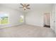 Spacious bedroom features soft carpet, neutral walls, a ceiling fan and two large windows at 40 Tuskeegee Dr, Smithfield, NC 27577