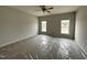 Bright bedroom with plush carpeting and two large windows offering plenty of natural light at 40 Tuskeegee Dr, Smithfield, NC 27577