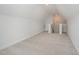 A bonus room features neutral walls, carpeted floors, and stairway access at 40 Tuskeegee Dr, Smithfield, NC 27577