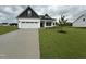 Charming single-Gathering home featuring a well-maintained lawn and an attached two-car garage at 40 Tuskeegee Dr, Smithfield, NC 27577