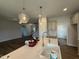 Kitchen island featuring a stainless steel sink and modern pendant lighting at 40 Tuskeegee Dr, Smithfield, NC 27577