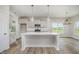 Modern kitchen featuring a central island, pendant lights, and ample counter space at 40 Tuskeegee Dr, Smithfield, NC 27577