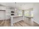 Contemporary kitchen with an island, sleek appliances, and a window overlooking the yard at 40 Tuskeegee Dr, Smithfield, NC 27577