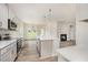 Modern kitchen with stainless appliances, white cabinets, countertops, and backsplash tile at 40 Tuskeegee Dr, Smithfield, NC 27577