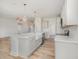 Open-concept kitchen with a large island, stainless steel appliances, and wood-style flooring at 40 Tuskeegee Dr, Smithfield, NC 27577