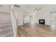 Spacious living room with fireplace and luxury vinyl plank flooring at 40 Tuskeegee Dr, Smithfield, NC 27577